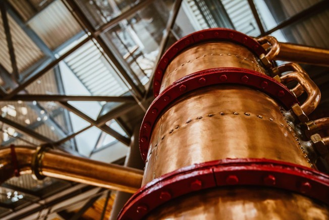 tall bronze barrel below skylight scaled