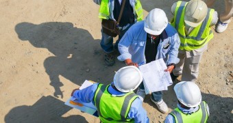 Aerial view group of construction worker meeting at construction site